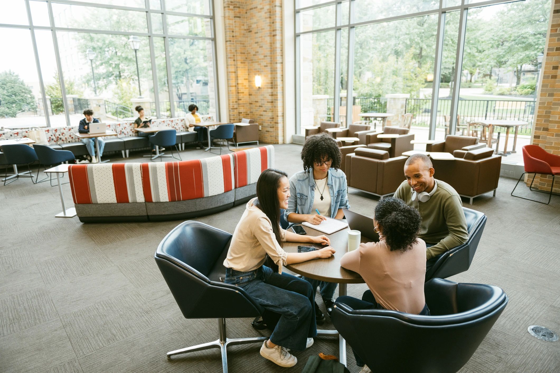 People gathered around a round-table community discussion